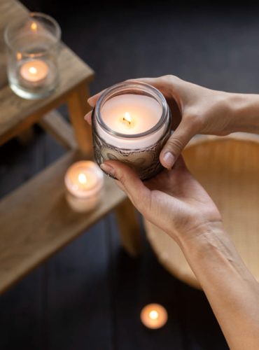 woman-holding-candle-high-angle